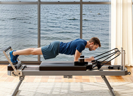 Extra Large Pilates Reformer - Multi-functional Home Fitness Equipment, 395lbs Capacity, with Dynamic Resistance Cords and Aerobic Rebounder, Improves Posture, Builds Strength, Reduces Stress, black